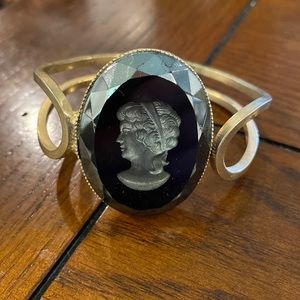 Gold bracelet with portrait accent